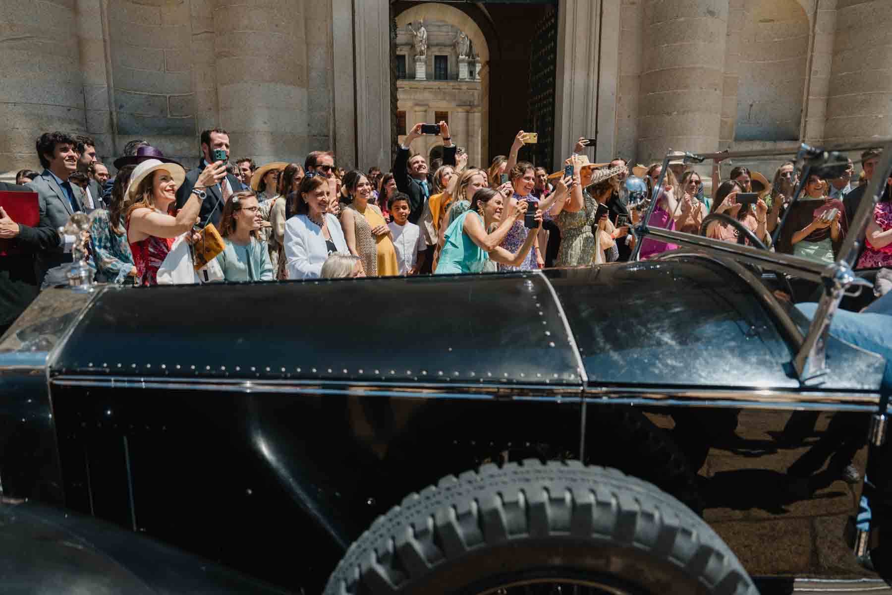 Cristina waving from wedding car