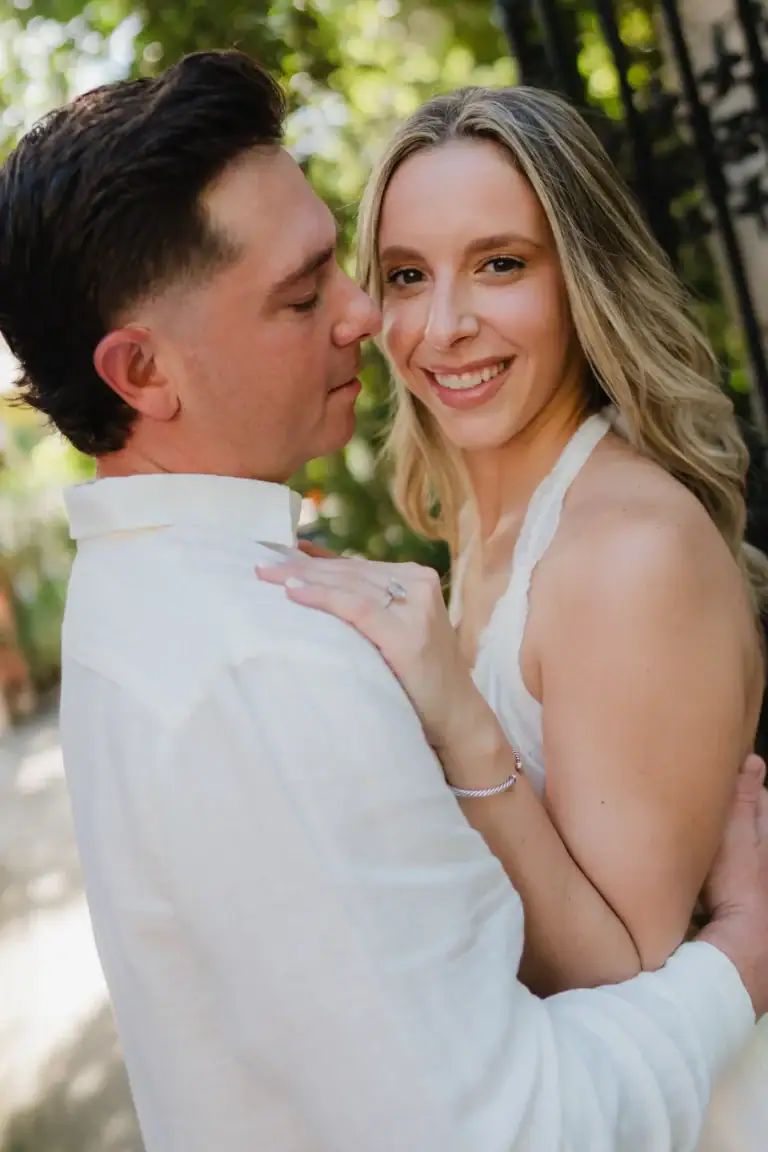 Smiling portrait of Gabby and Mike during their Vizcaya Gardens engagement session in Miami