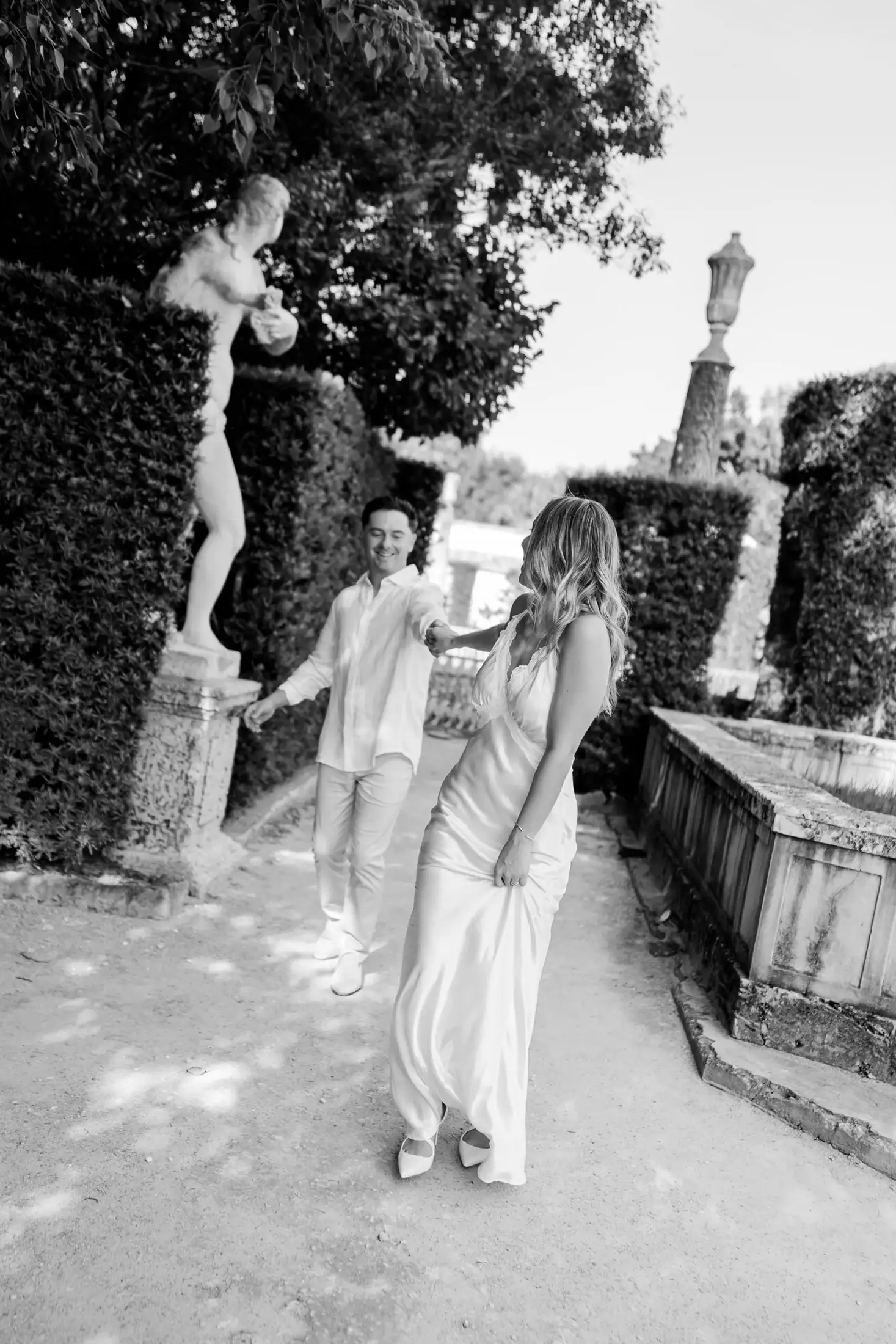 Black and white candid portrait of Gabby and Mike at Vizcaya Museum and Gardens