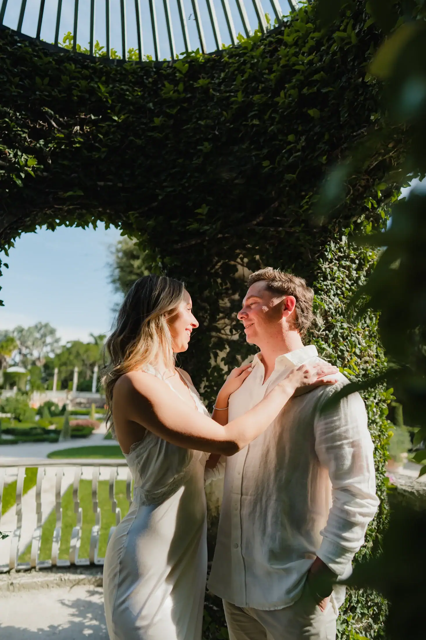 Gabby and Mike embracing in the gardens during their Vizcaya engagement photos