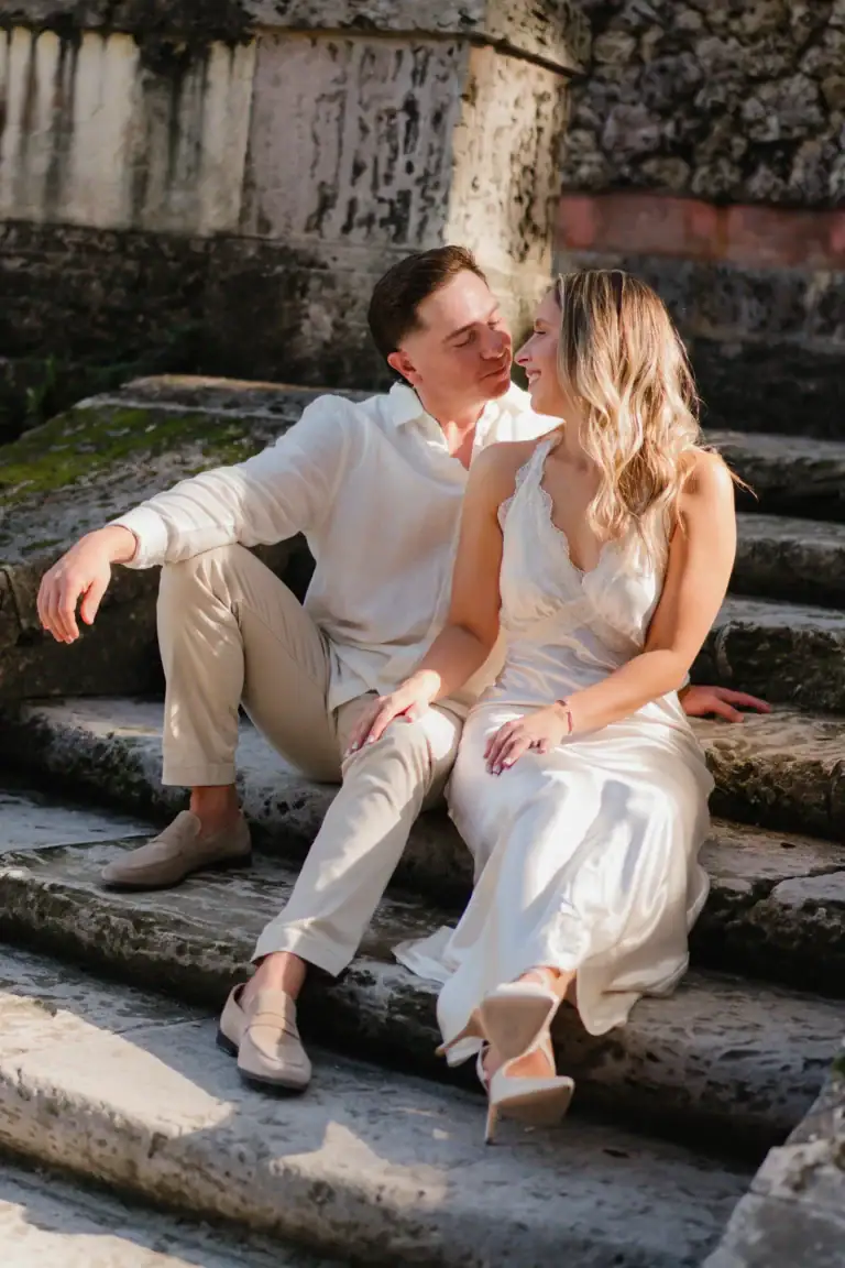 Romantic portrait of Gabby and Mike on the stone steps