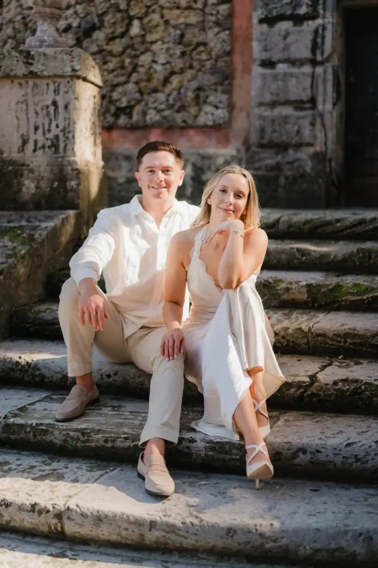 Seated portrait of Gabby and Mike on Vizcaya’s stairs
