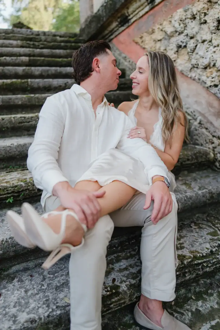 Close seated portrait of Gabby and Mike during their engagement session