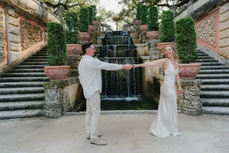 Couple portrait of Gabby and Mike on the stone steps at Vizcaya