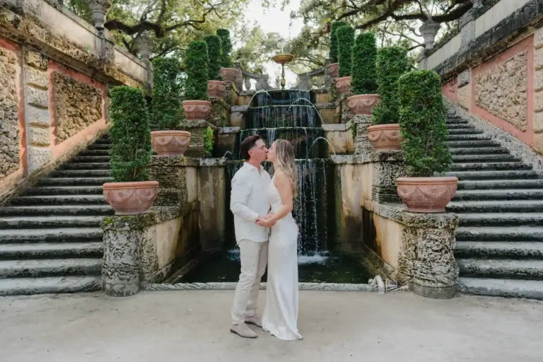 Gabby and Mike on architectural steps during their Vizcaya session