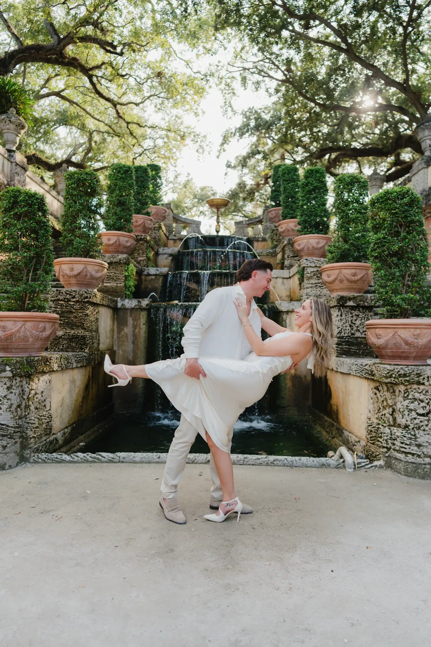 Gabby moving her dress during the editorial Vizcaya engagement session