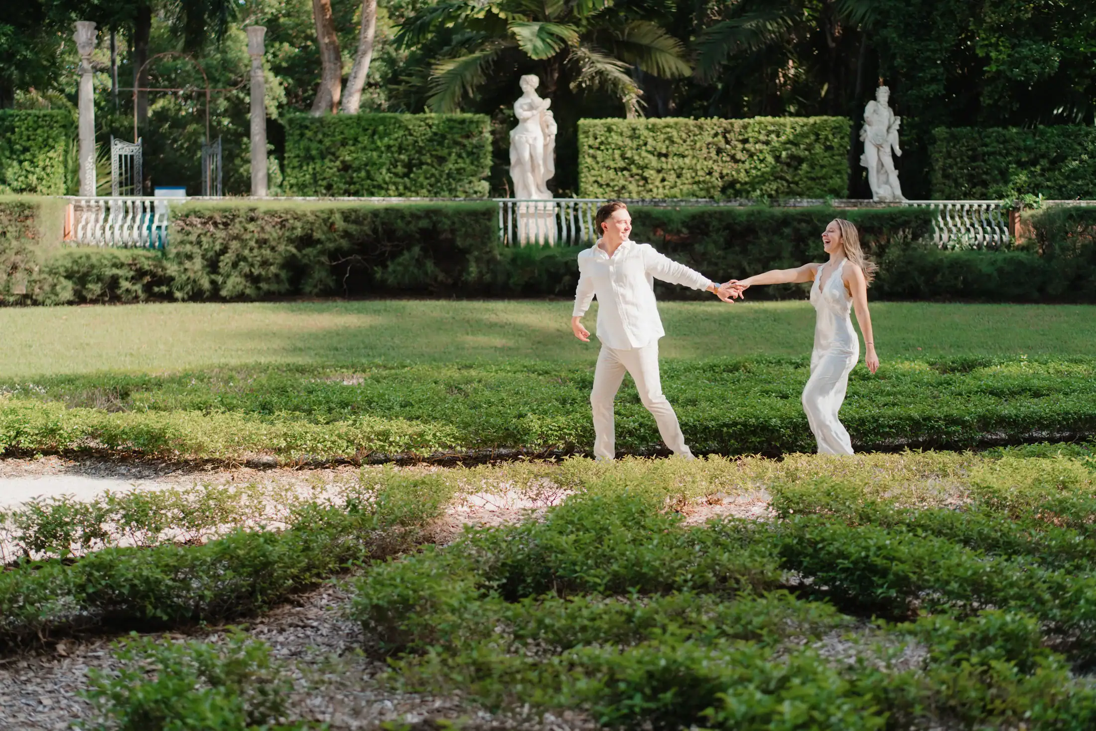 Gabby and Mike photographed together in the formal garden at Vizcaya Museum and Gardens
