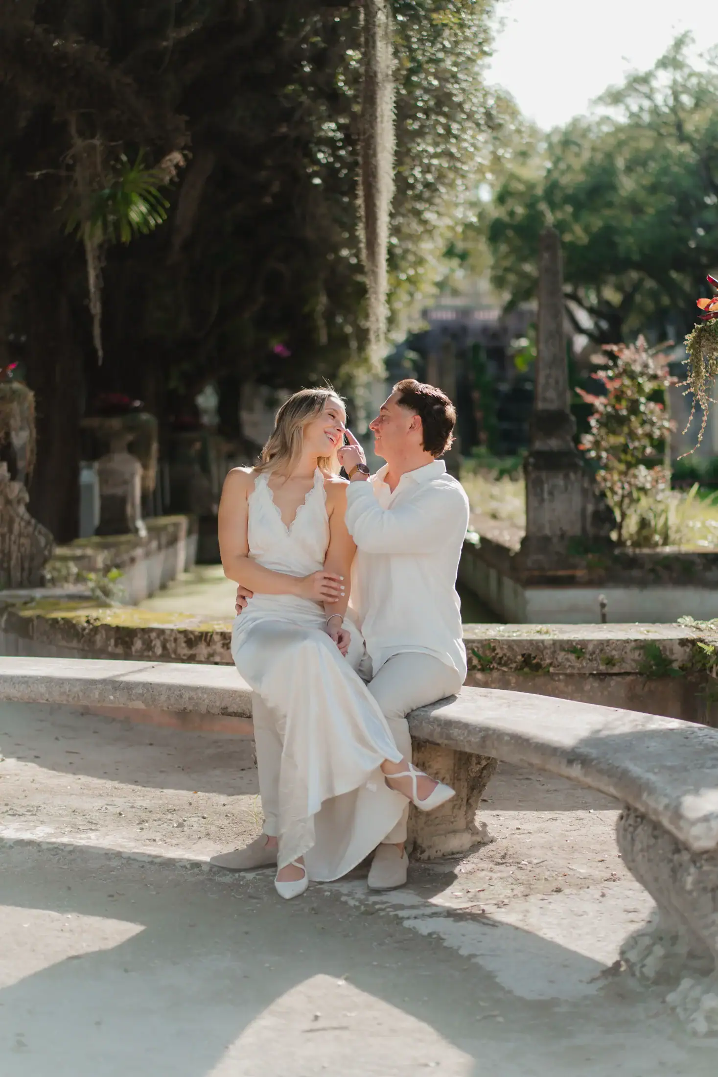 Seated garden portrait of Gabby and Mike at Vizcaya Museum and Gardens in Miami