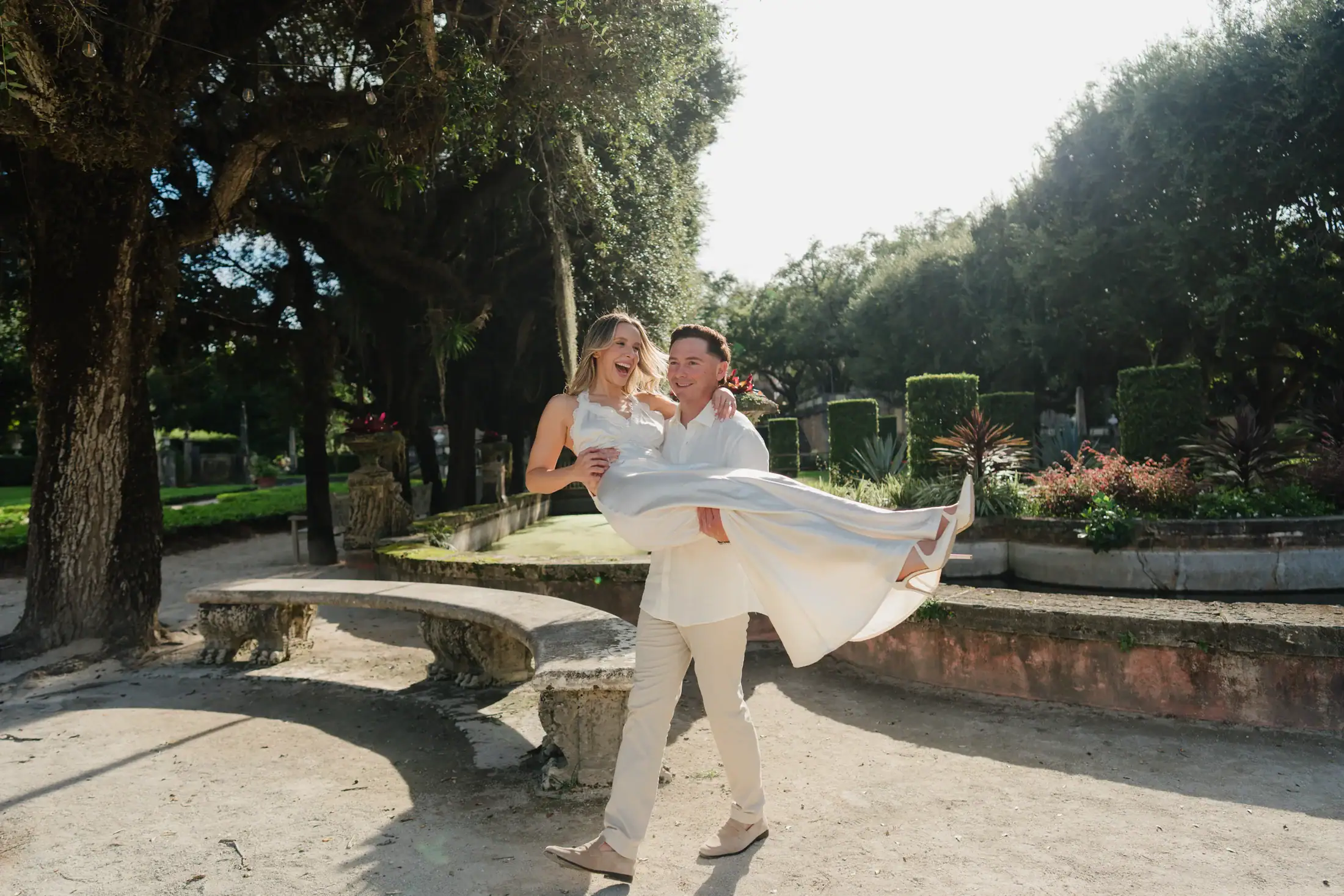Backlit garden steps portrait of Gabby and Mike during their Vizcaya engagement session