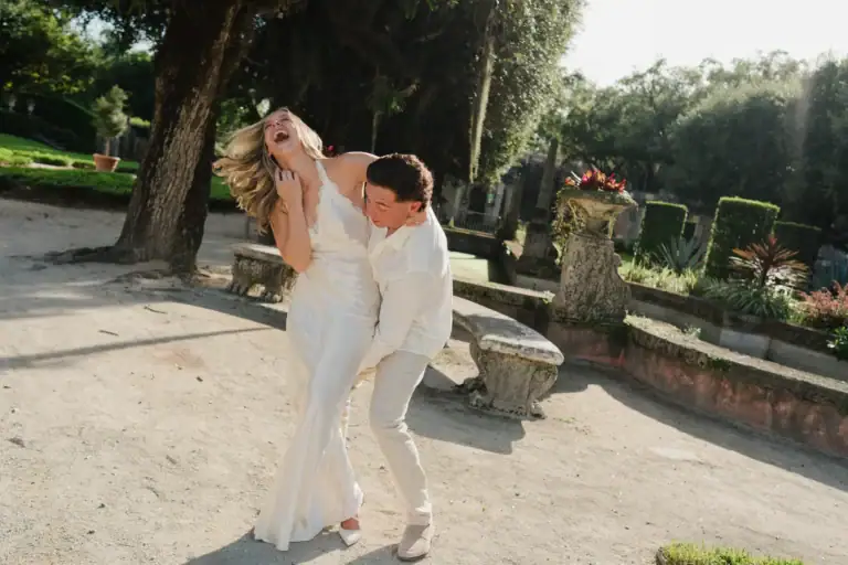 Gabby and Mike sharing a romantic movement near the waterfront gardens at Vizcaya