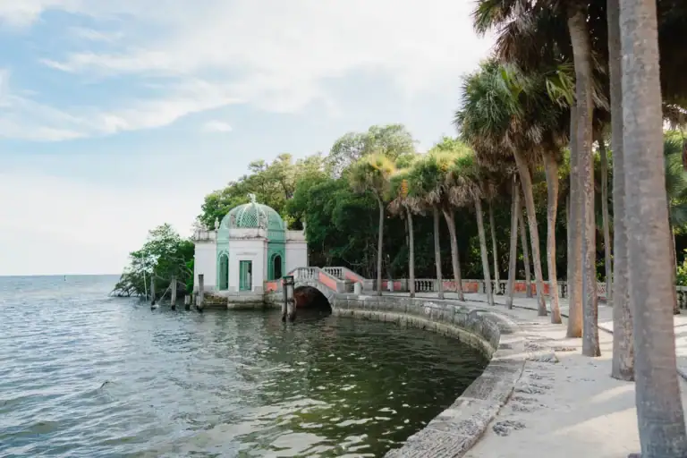 Waterfront palm path at Vizcaya Museum and Gardens during Gabby and Mike’s engagement session