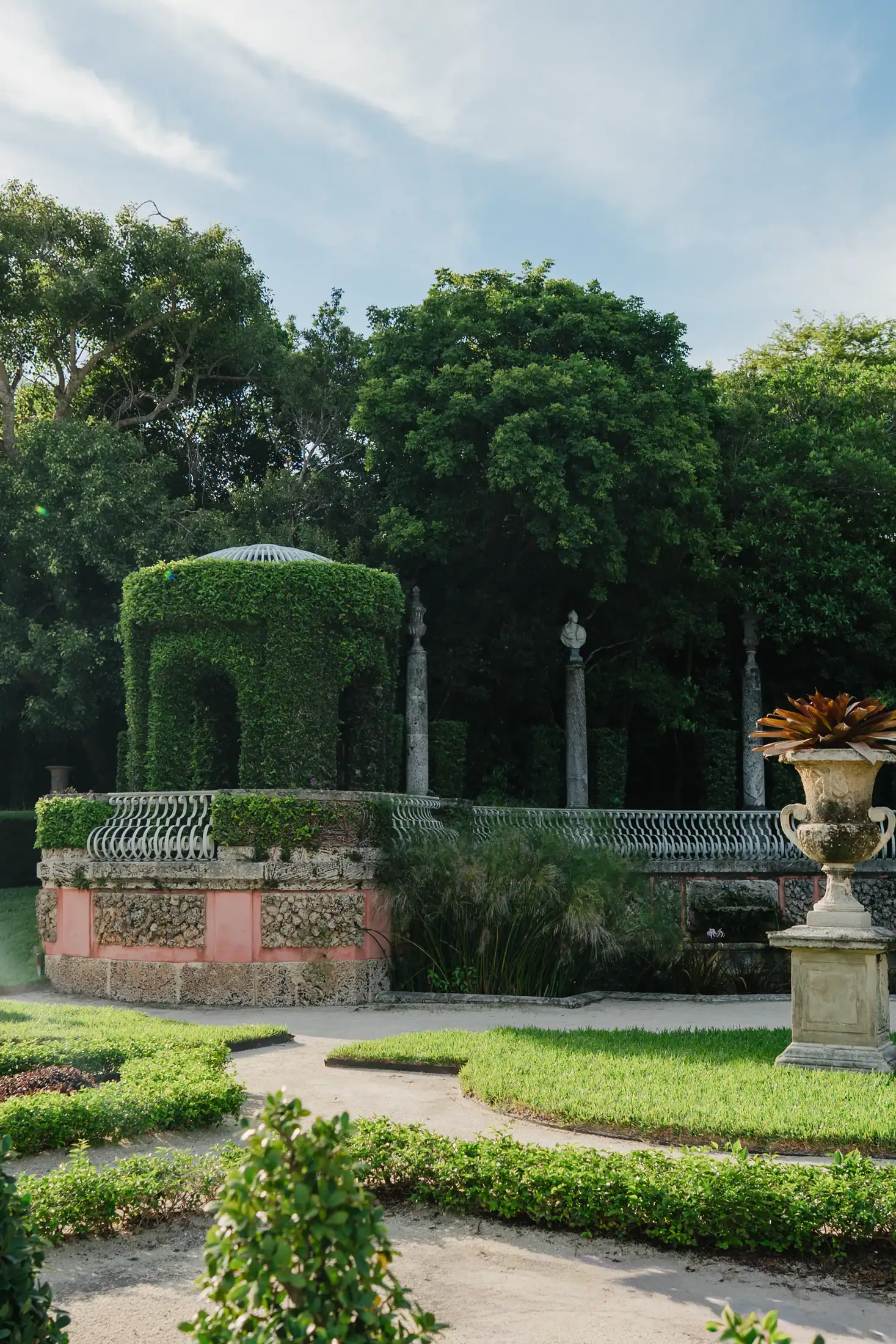 Secret garden path at Vizcaya Museum and Gardens during Gabby and Mike’s engagement session in Miami