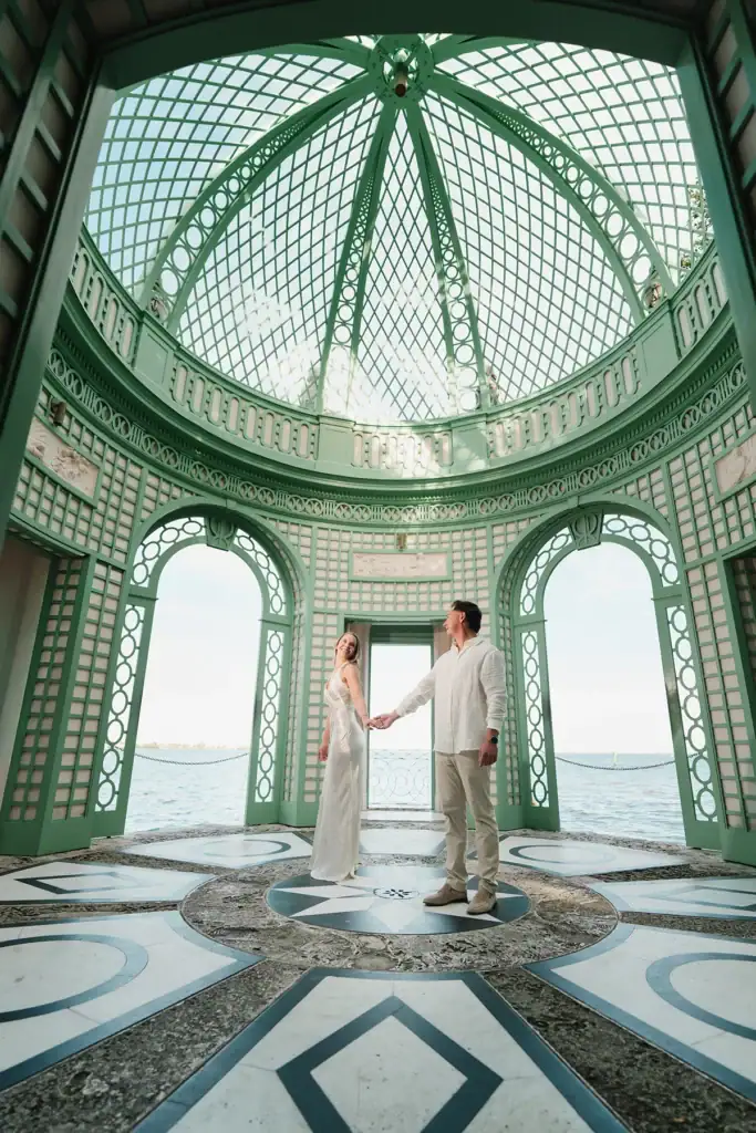 Gabby and Mike during their Vizcaya Gardens engagement session inside the iconic Tea House dome in Miami