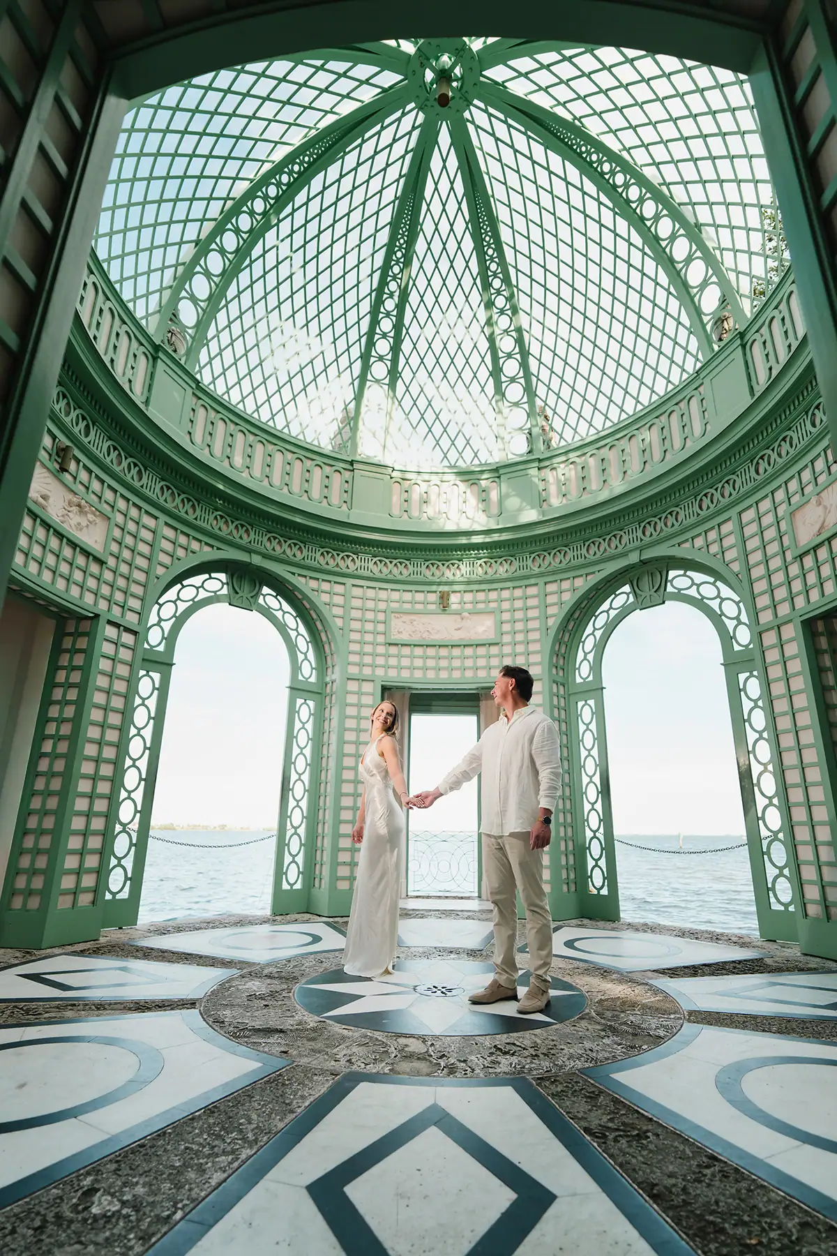 Gabby and Mike during their Vizcaya Gardens engagement session inside the iconic Tea House dome in Miami